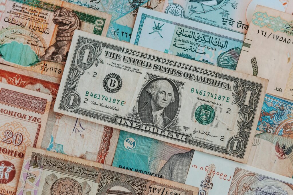 pexels-photo-4025825-4025825 Close-up of various international banknotes creating a diverse currency background.